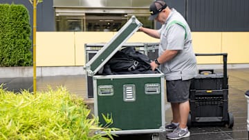 Kenny Farr, Oregon’s football equipment administrator, checks cases as the Oregon Ducks’ equipment staff loads the truck before setting out for Northwestern on Sept. 9, 2025.