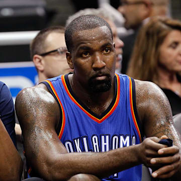 Jan 18, 2015; Orlando, FL, USA; Oklahoma City Thunder forward Kevin Durant (35) and center Kendrick Perkins (5) look on from the bench against the Orlando Magic during the second half at Amway Center. Oklahoma City Thunder defeated the Orlando Magic 127-99. Mandatory Credit: Kim Klement-Imagn Images