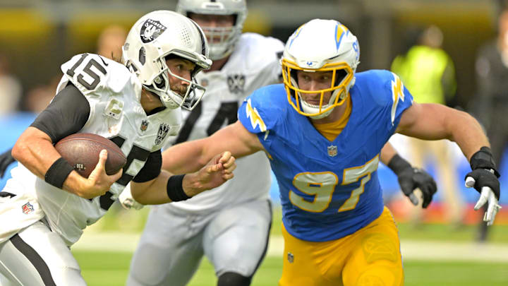 Sep 8, 2024; Inglewood, California, USA; Las Vegas Raiders quarterback Gardner Minshew (15) is sacked by Los Angeles Chargers linebacker Joey Bosa (97) in the second half at SoFi Stadium. Mandatory Credit: Jayne Kamin-Oncea-Imagn Images