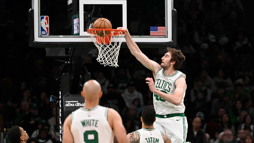 Apr 11, 2025; Boston, Massachusetts, USA; Boston Celtics center Luke Kornet (40) dunks the ball against the Charlotte Hornets during the second half at TD Garden. Mandatory Credit: Eric Canha-Imagn Images