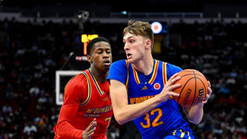 Apr 2, 2024; Houston, TX, USA; McDonald's All American East forward Cooper Flagg (32) controls the ball as McDonald's All American West guard Valdez Edgecombe Jr (7) defends during the first half at Toyota Center. Mandatory Credit: Maria Lysaker-USA TODAY Sports