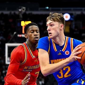 Apr 2, 2024; Houston, TX, USA; McDonald's All American East forward Cooper Flagg (32) controls the ball as McDonald's All American West guard Valdez Edgecombe Jr (7) defends during the first half at Toyota Center. Mandatory Credit: Maria Lysaker-Imagn Images