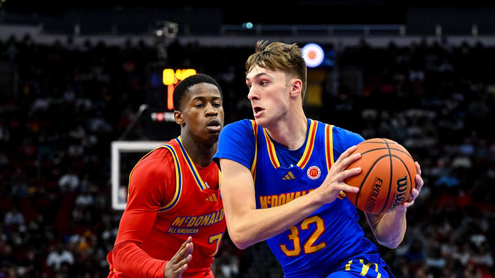 Apr 2, 2024; Houston, TX, USA; McDonald's All American East forward Cooper Flagg (32) controls the ball as McDonald's All American West guard Valdez Edgecombe Jr (7) defends during the first half at Toyota Center. Mandatory Credit: Maria Lysaker-USA TODAY Sports