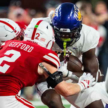 Sep 14, 2024; Lincoln, Nebraska, USA; Northern Iowa Panthers running back Amauri Pesek-Hickson (5) runs against Nebraska Cornhuskers defensive back Isaac Gifford (2) during the second quarter at Memorial Stadium.