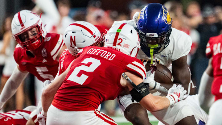 Sep 14, 2024; Lincoln, Nebraska, USA; Northern Iowa Panthers running back Amauri Pesek-Hickson (5) runs against Nebraska Cornhuskers defensive back Isaac Gifford (2) during the second quarter at Memorial Stadium.