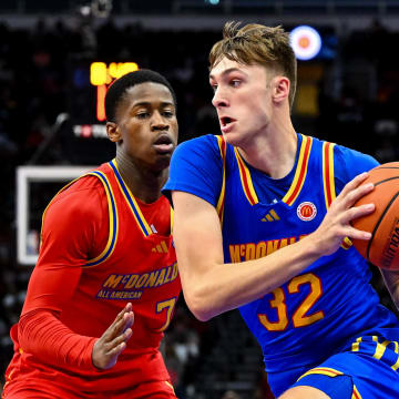 Apr 2, 2024; Houston, TX, USA; McDonald's All American East forward Cooper Flagg (32) controls the ball as McDonald's All American West guard Valdez Edgecombe Jr (7) defends during the first half at Toyota Center. Mandatory Credit: Maria Lysaker-USA TODAY Sports