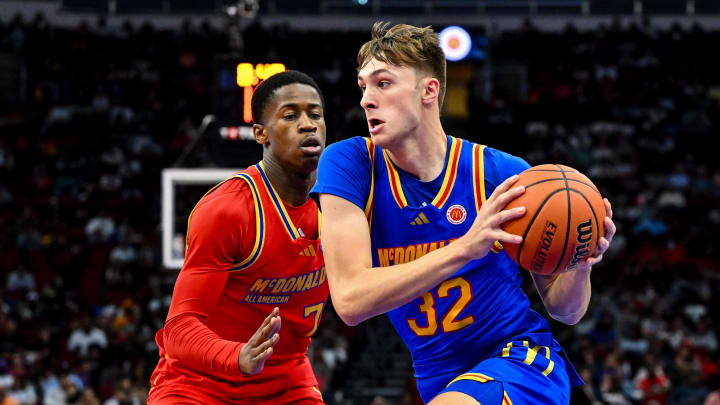 Apr 2, 2024; Houston, TX, USA; McDonald's All American East forward Cooper Flagg (32) controls the ball as McDonald's All American West guard Valdez Edgecombe Jr (7) defends during the first half at Toyota Center. Mandatory Credit: Maria Lysaker-USA TODAY Sports