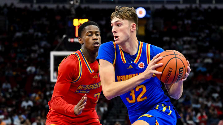 Apr 2, 2024; Houston, TX, USA; McDonald's All American East forward Cooper Flagg (32) controls the ball as McDonald's All American West guard Valdez Edgecombe Jr (7) defends during the first half at Toyota Center. Mandatory Credit: Maria Lysaker-USA TODAY Sports