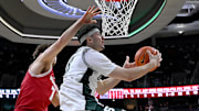 Michigan State is a small favorite against Wisconsin in the Big Ten semifinal.