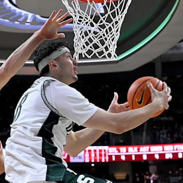 Michigan State is a small favorite against Wisconsin in the Big Ten semifinal.