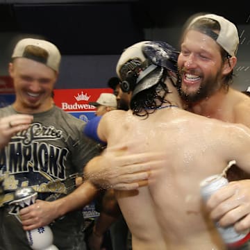 Oct 31, 2025; Toronto, Ontario, CAN; Los Angeles Dodgers pitcher Clayton Kershaw (22) and first baseman Enrique Hernandez (8) celebrate after defeating the Toronto Blue Jays in the 2025 MLB World Series at Rogers Centre. Mandatory Credit: John E. Sokolowski-Imagn Images