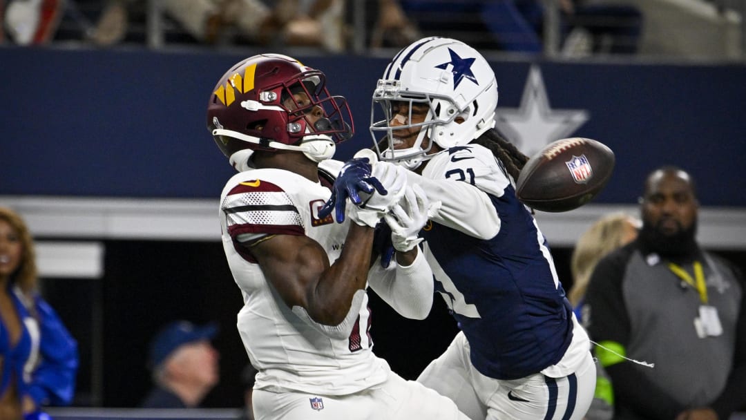 Nov 23, 2023; Arlington, Texas, USA; Dallas Cowboys cornerback Stephon Gilmore (21) breaks up a pass intended for Washington Commanders wide receiver Terry McLaurin (17) during the second half at AT&T Stadium. Mandatory Credit: Jerome Miron-USA TODAY Sports