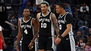 Mar 1, 2025; Memphis, Tennessee, USA; San Antonio Spurs forward Jeremy Sochan (10) reacts with guard De'Aaron Fox (4) and forward Keldon Johnson (0) during a time out during the second quarter against the Memphis Grizzlies at FedExForum. Mandatory Credit: Petre Thomas-Imagn Images