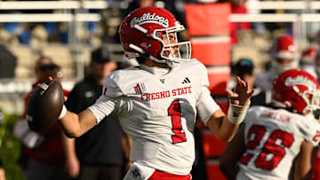 Nov 30, 2024; Pasadena, California, USA; Fresno State Bulldogs quarterback Mikey Keene (1) looks for a receiver during the third quarter against the UCLA Bruins at Rose Bowl. Mandatory Credit: Robert Hanashiro-Imagn Images