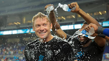 Jul 18, 2025; Miami, Florida, USA; Miami Marlins left fielder Kyle Stowers (28) is doused with water by teammates after hitting a two-run walk-off home run against the Kansas City Royals during the tenth inning at loanDepot Park. Mandatory Credit: Sam Navarro-Imagn Images