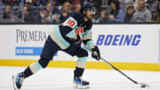 Seattle Kraken center Matty Beniers skates with the puck against the Montreal Canadiens during the first period at Climate Pledge Arena. 