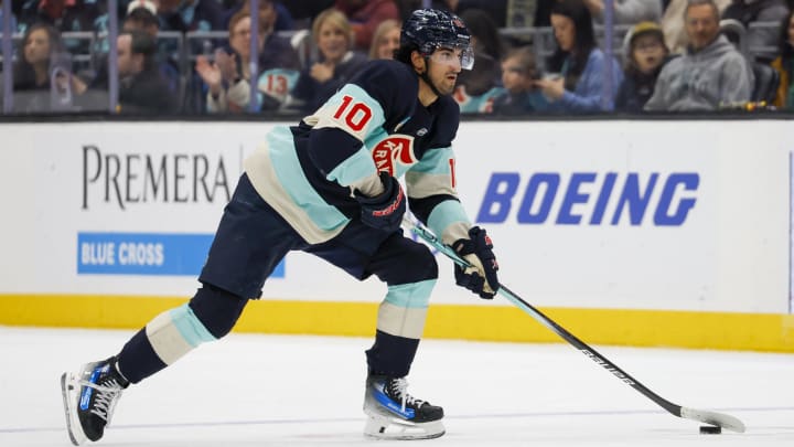 Seattle Kraken center Matty Beniers skates with the puck against the Montreal Canadiens during the first period at Climate Pledge Arena. 