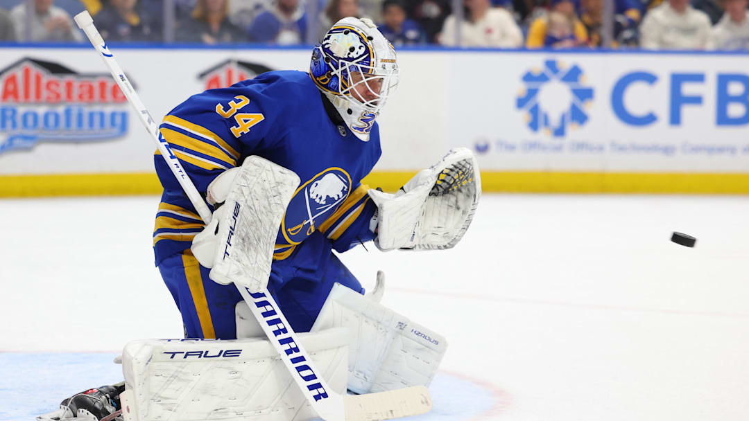 Mar 7, 2026; Buffalo, New York, USA;  Buffalo Sabres goaltender Alex Lyon (34) looks to make a glove save during the third period against the Nashville Predators at KeyBank Center. Mandatory Credit: Timothy T. Ludwig-Imagn Images