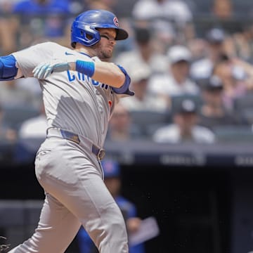 Jul 13, 2025; Bronx, New York, USA; Chicago Cubs left fielder Ian Happ (8)] hits a single against the New York Yankees during the second inning at Yankee Stadium. 