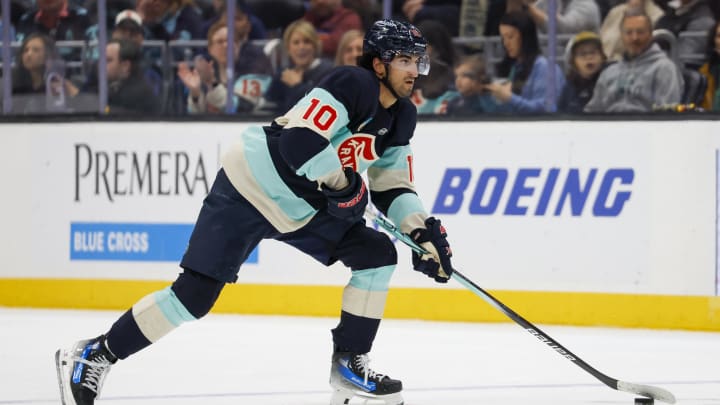 Mar 24, 2024; Seattle, Washington, USA; Seattle Kraken center Matty Beniers (10) skates with the puck against the Montreal Canadiens during the first period at Climate Pledge Arena. Mandatory Credit: Joe Nicholson-USA TODAY Sports