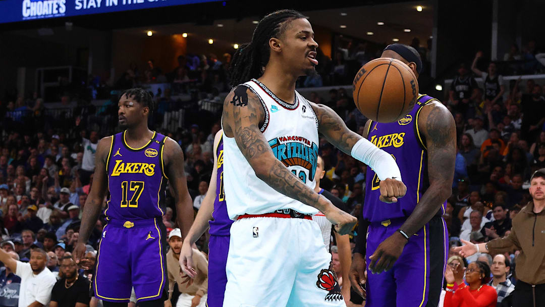 Mar 29, 2025; Memphis, Tennessee, USA; Memphis Grizzlies guard Ja Morant (12) reacts after a basket during the third quarter against the Los Angeles Lakers at FedExForum. Mandatory Credit: Petre Thomas-Imagn Images