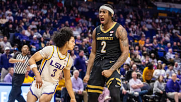 Jan 4, 2025; Baton Rouge, Louisiana, USA;  Vanderbilt Commodores guard MJ Collins Jr. (2) reacts after dunking against LSU Tigers guard Curtis Givens III (3) during the second half at Pete Maravich Assembly Center.