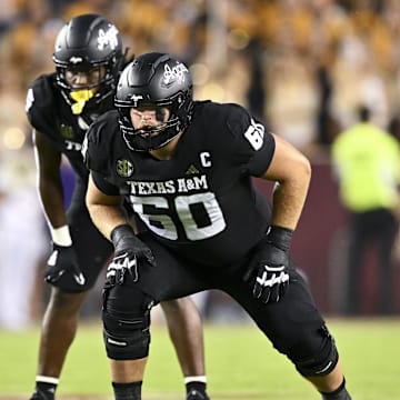 Oct 26, 2024; College Station, Texas, USA; Texas A&M Aggies offensive lineman Trey Zuhn III (60) lines up during the second quarter against the LSU Tigers. The Aggies defeated the Tigers 38-23; at Kyle Field. Mandatory Credit: Maria Lysaker-Imagn Images.  