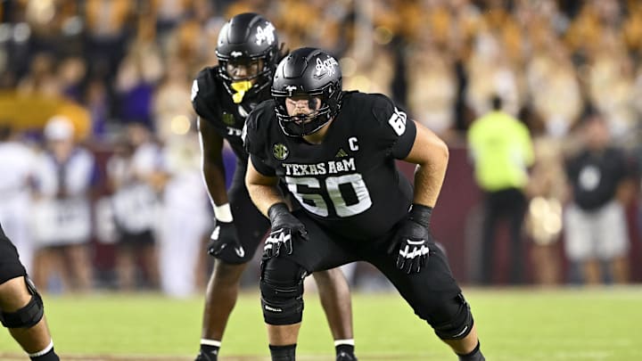 Oct 26, 2024; College Station, Texas, USA; Texas A&M Aggies offensive lineman Trey Zuhn III (60) lines up during the second quarter against the LSU Tigers. The Aggies defeated the Tigers 38-23; at Kyle Field. Mandatory Credit: Maria Lysaker-Imagn Images.  