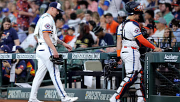 Apr 21, 2025; Houston, Texas, USA; Houston Astros starting pitcher Hunter Brown (58) and Houston Astros catcher Yainer Diaz (21) walk to the dugout after warming up prior to the game against the Toronto Blue Jays at Daikin Park. Mandatory Credit: Erik Williams-Imagn Images