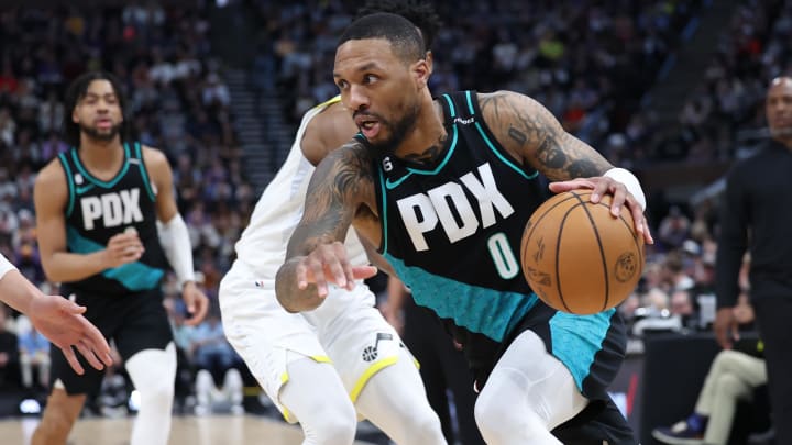 Mar 22, 2023; Salt Lake City, Utah, USA; Portland Trail Blazers guard Damian Lillard (0) goes to the basket against the Utah Jazz in the second quarter at Vivint Arena. Mandatory Credit: Rob Gray-USA TODAY Sports