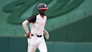 Sep 1, 2024; Washington, District of Columbia, USA; Washington Nationals second baseman Darren Baker (10) jogs back to the dugout during his Major League debut against the Chicago Cubs during the ninth inning at Nationals Park