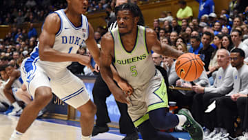 Dec 30, 2023; Durham, North Carolina, USA; Queens Royals guard AJ McKee (5) dribbles the ball against Duke. 