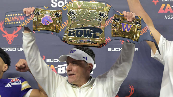 Dec 13, 2025; Inglewood, CA, USA;  Washington Huskies head coach Jedd Fisch holds the LA Bowl championship belt presented by Rob Gronkowski after defeating the Boise State Broncos at SoFi Stadium. Mandatory Credit: Jayne Kamin-Oncea-Imagn Images