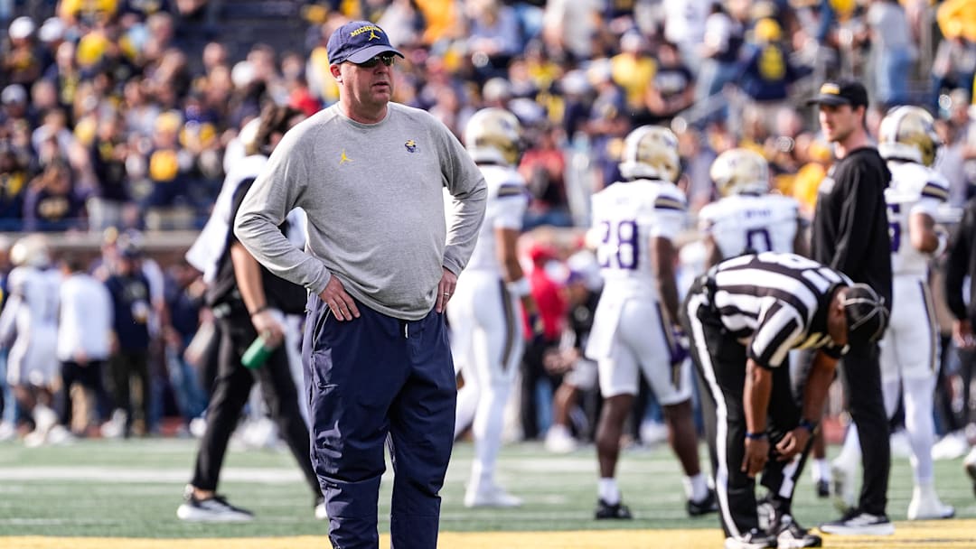 Michigan offensive coordinator Chip Lindsey watches warmup ahead of the Washington game at Michigan Stadium in Ann Arbor on Saturday, Oct. 18, 2025.