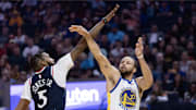 Oct 17, 2025; San Francisco, California, USA; Golden State Warriors guard Stephen Curry (30) is fouled by Los Angeles Clippers forward Derrick Jones Jr. (5) as he shoots during the first quarter at Chase Center. Mandatory Credit: D. Ross Cameron-Imagn Images