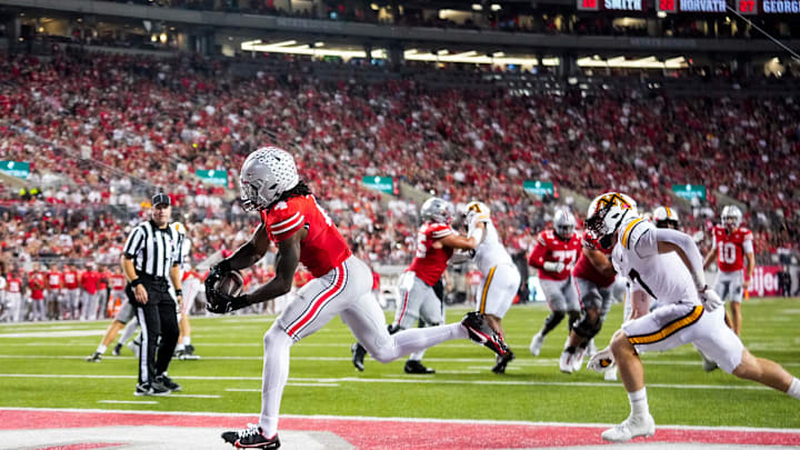 Ohio State Buckeyes wide receiver Jeremiah Smith (4) catches a touchdown pass in the second half of the NCAA football game at Ohio Stadium on Saturday, Oct. 4, 2025 in Columbus, Ohio.
