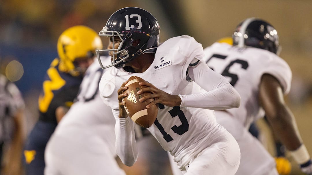 Sep 5, 2015; Morgantown, WV, USA; Georgia Southern Eagles quarterback Favian Upshaw rolls out of the pocket during the first half against the West Virginia Mountaineers at Milan Puskar Stadium. Mandatory Credit: Ben Queen-Imagn Images