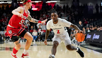 Cincinnati Bearcats guard Jizzle James (2) handles the ball in the first half of a NCAA men’s basketball game between the Cincinnati Bearcats and Utah Utes, Tuesday, Feb. 11, 2025, at Fifth Third Arena in Cincinnati.
