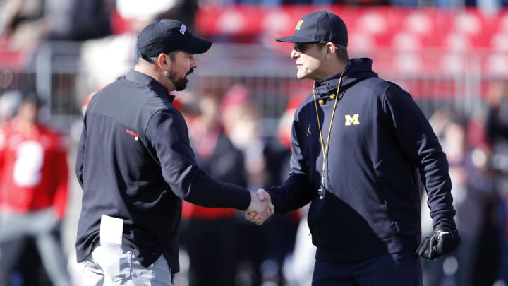 Nov 26, 2022; Columbus, Ohio, USA; Michigan Wolverines head coach Jim Harbaugh (right) and Ohio State Buckeyes head coach Ryan Day (left) shake hands before the game at Ohio Stadium. Mandatory Credit: Joseph Maiorana-USA TODAY Sports