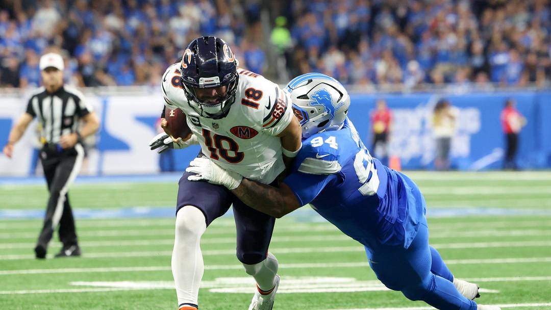 Sep 14, 2025; Detroit, Michigan, USA; Detroit Lions defensive tackle Mekhi Wingo (94) tackles Chicago Bears quarterback Caleb Williams (18) during the second quarter of the game at Ford Field. Mandatory Credit: David Reginek-Imagn Images