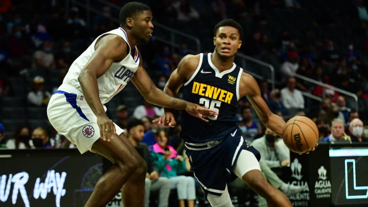 Oct 4, 2021; Los Angeles, California, USA; Denver Nuggets guard PJ Dozier (35) moves to the basket against Los Angeles Clippers forward Moses Wright (11) during the second half at Staples Center. Mandatory Credit: Gary A. Vasquez-USA TODAY Sports
