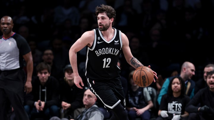 Mar 21, 2023; Brooklyn, New York, USA; Brooklyn Nets forward Joe Harris (12) dribbles during the first half against the Cleveland Cavaliers at Barclays Center. Mandatory Credit: Vincent Carchietta-USA TODAY Sports