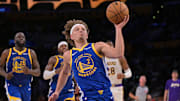 Oct 12, 2025; Los Angeles, California, USA;  Golden State Warriors guard Brandin Podziemski (2) drives to the basket during the second half against the Los Angeles Lakers at Crypto.com Arena. Mandatory Credit: Jayne Kamin-Oncea-Imagn Images
