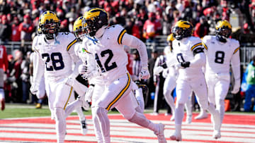 Michigan defensive back Aamir Hall (12) celebrates an interception against Ohio State during the first half at Ohio Stadium in Columbus, Ohio on Saturday, Nov. 30, 2024.