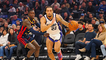 Jan 5, 2025; San Francisco, California, USA; Sacramento Kings guard Devin Carter (22) drives in against Golden State Warriors guard Dennis Schroder (71) during the first quarter at Chase Center. Mandatory Credit: Kelley L Cox-Imagn Images