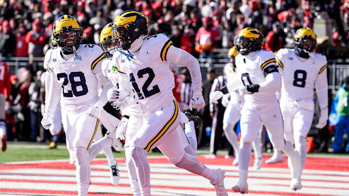 Michigan defensive back Aamir Hall (12) celebrates an interception against Ohio State during the first half at Ohio Stadium in Columbus, Ohio on Saturday, Nov. 30, 2024.