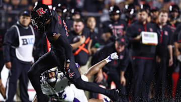 Sep 27, 2024; Piscataway, New Jersey, USA; Rutgers Scarlet Knights wide receiver KJ Duff (8) is tackled by Washington Huskies cornerback Elijah Jackson (25) during the first half at SHI Stadium. Mandatory Credit: Vincent Carchietta-Imagn Images