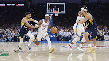 Mar 29, 2025; Oklahoma City, Oklahoma, USA; Oklahoma City Thunder guard Shai Gilgeous-Alexander (2) drives to the basket beside Indiana Pacers guard Tyrese Haliburton (0) during the second quarter at Paycom Center. Mandatory Credit: Alonzo Adams-Imagn Images