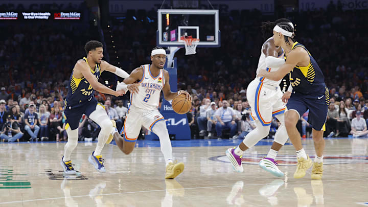 Mar 29, 2025; Oklahoma City, Oklahoma, USA; Oklahoma City Thunder guard Shai Gilgeous-Alexander (2) drives to the basket beside Indiana Pacers guard Tyrese Haliburton (0) during the second quarter at Paycom Center. Mandatory Credit: Alonzo Adams-Imagn Images