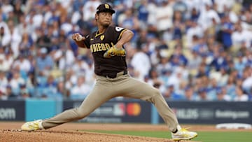 Oct 11, 2024; Los Angeles, California, USA; San Diego Padres pitcher Yu Darvish (11) pitches against the Los Angeles Dodgers in the first inning during game five of the NLDS for the 2024 MLB Playoffs at Dodger Stadium. Mandatory Credit: Kiyoshi Mio-Imagn Images